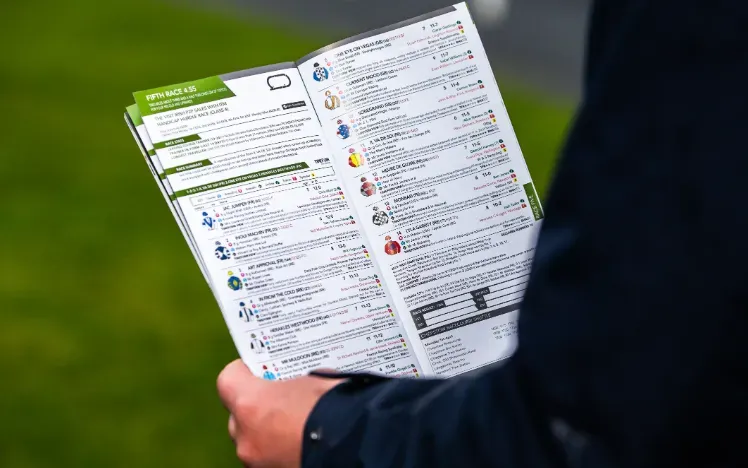 A close up of the details of a racecard at Chepstow